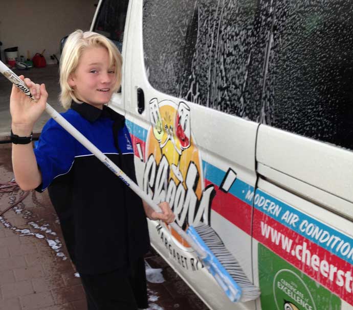Jayden-690×607 a person holding a toothbrush