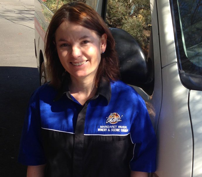 Juliette a little girl standing in front of a blue car